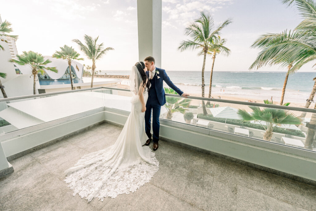 wedding couple at la concha resort with Perla and the ocean as the background