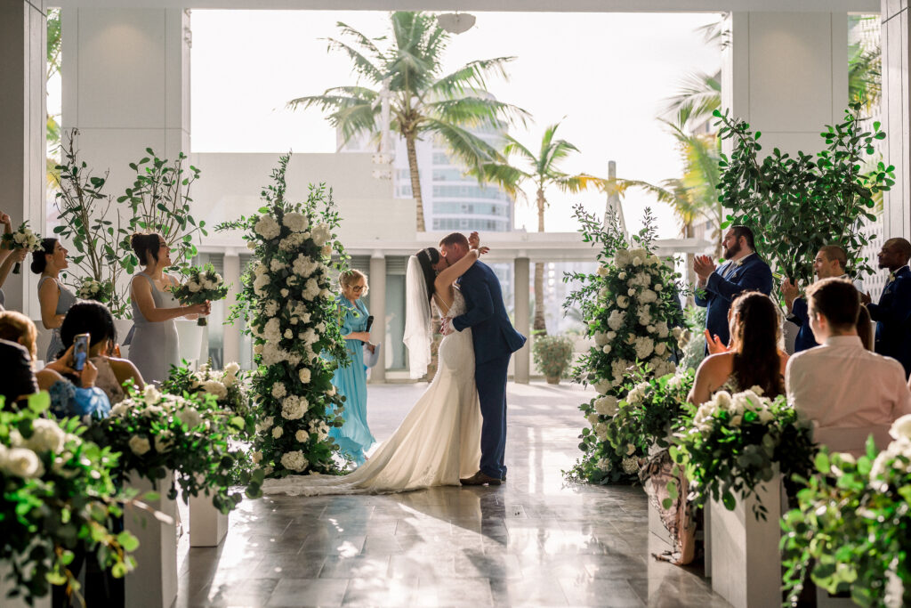 wedding couple sharing their kiss at wedding ceremony