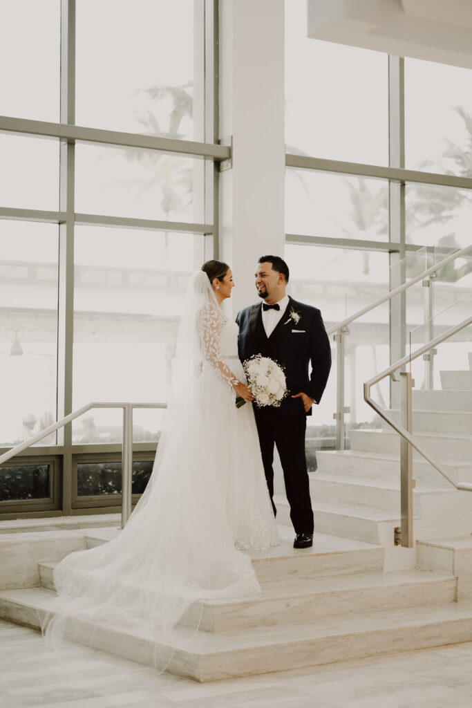 wedding at la concha resort - couple posing in front of stairs